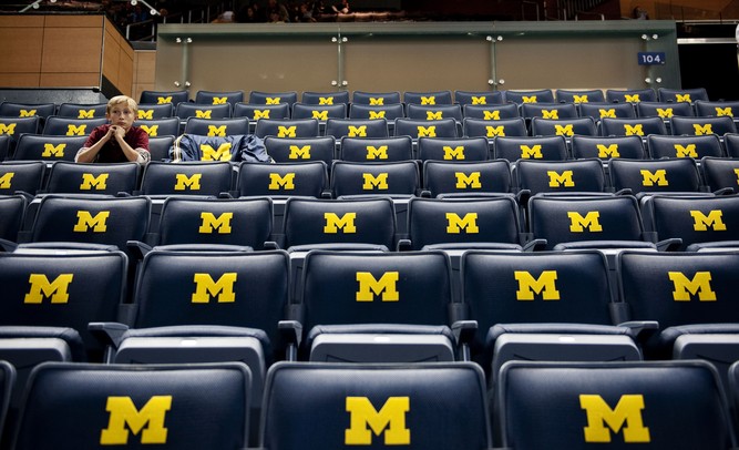 Patrick Bertoni, 12, waits for his dad before the Michigan game against Saginaw Valley State on Monday. Daniel Brenner I AnnArbor.com
